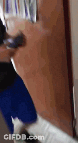 Blurry Person Walking Through Door GIF