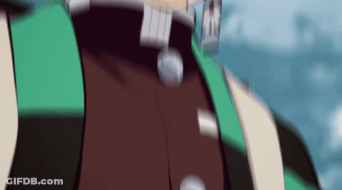 A Blurry Picture Of A Person Wearing A Green And Brown Jacket GIF