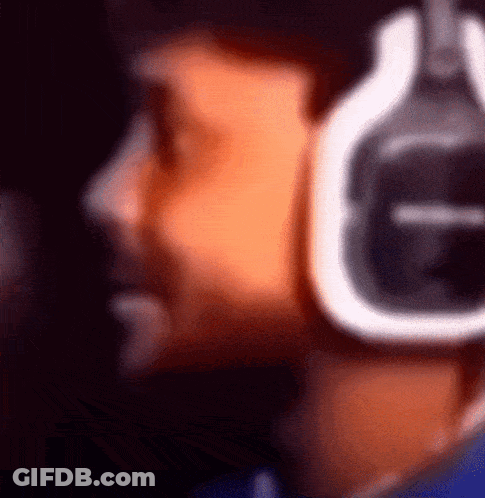 A Blurry Picture Of A Person Wearing Headphones With The Letter G On The Bottom GIF