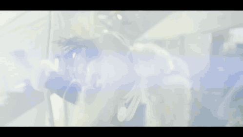A Blurry Picture Of A Person With A Blue Light Coming From Their Head GIF
