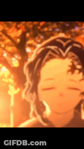 A Blurry Picture Of A Person With A Tree In The Background GIF