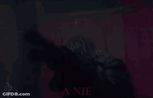 A Blurry Picture Of A Person With The Word Biggest In The Background GIF