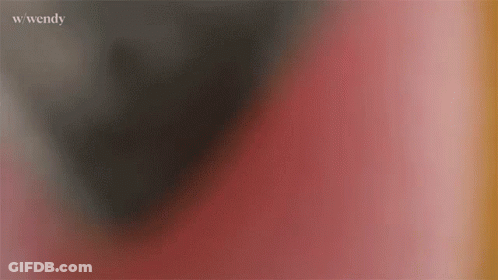 A Blurry Picture Of A Red And Black Background With The Word Wendy Written On The Bottom . GIF