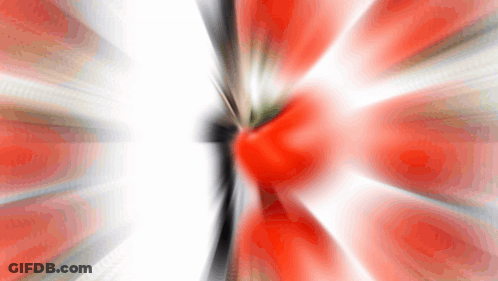 A Blurry Picture Of A Red And White Flower With A White Background GIF