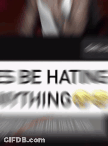 A Blurry Picture Of A Sign That Says " Be Hating Nothing " GIF
