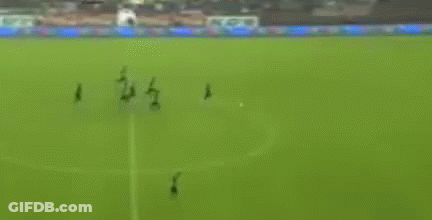 A Blurry Picture Of A Soccer Field With A Goal And A Stadium In The Background GIF