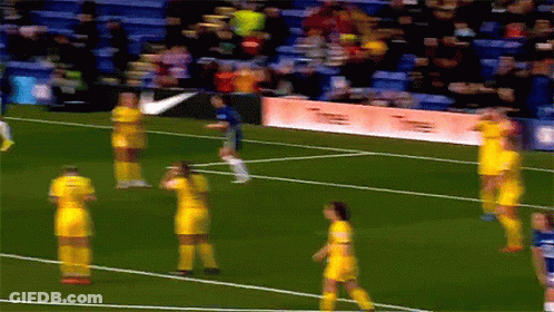 A Blurry Picture Of A Soccer Field With A Nike Banner In The Background GIF