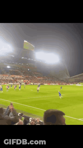 A Blurry Picture Of A Soccer Game Being Played GIF
