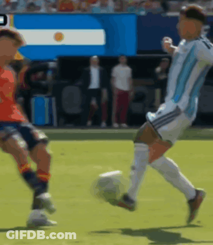 A Blurry Picture Of A Soccer Game With A Flag In The Background That Says ' Argentina ' GIF