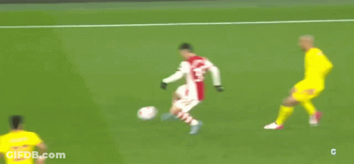 A Blurry Picture Of A Soccer Game With A Player Wearing A Number 14 Jersey GIF