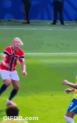 A Blurry Picture Of A Soccer Game With A Player Wearing The Number 5 GIF