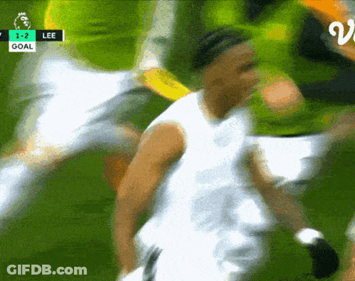 A Blurry Picture Of A Soccer Game With The Score 1-2 Lee GIF