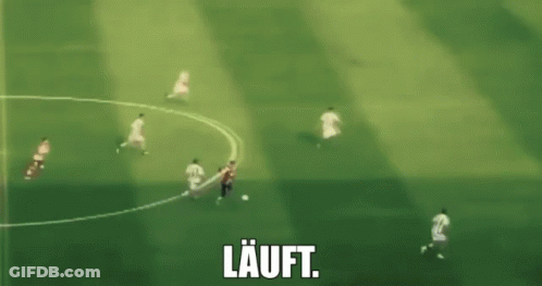 A Blurry Picture Of A Soccer Game With The Word Lauft In White GIF