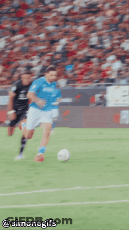 A Blurry Picture Of A Soccer Game With The Words @Simonegifs On The Bottom GIF