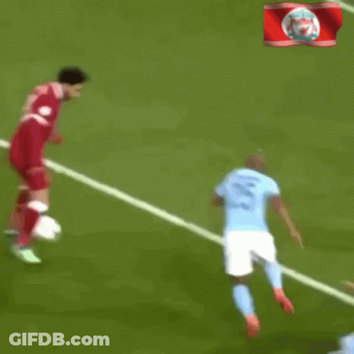 A Blurry Picture Of A Soccer Player Getting Ready To Kick The Ball Into The Goal GIF