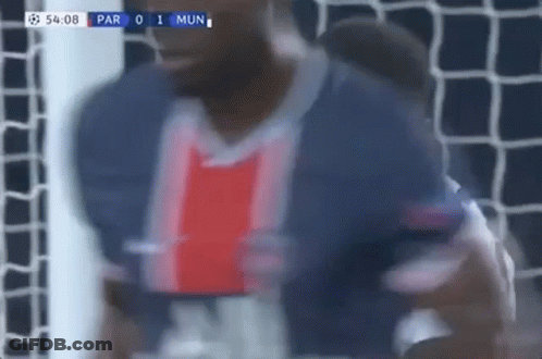 A Blurry Picture Of A Soccer Player Standing In Front Of A Goal During A Game . GIF