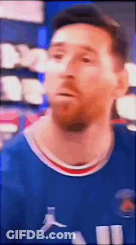 A Blurry Picture Of A Soccer Player Wearing A Blue Shirt . GIF
