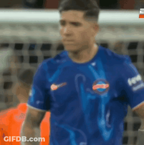 A Blurry Picture Of A Soccer Player Wearing A Blue Shirt That Says Pepsi GIF