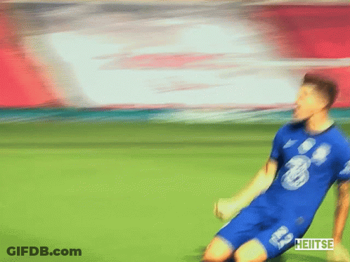 A Blurry Picture Of A Soccer Player Wearing A Blue Shirt With The Number 20 On It GIF