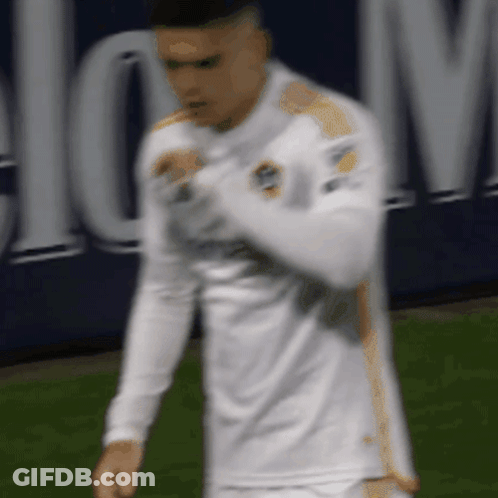 A Blurry Picture Of A Soccer Player Wearing A White Shirt GIF