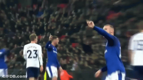 A Blurry Picture Of A Soccer Player Wearing Number 23 GIF