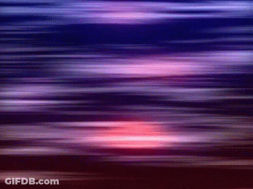 A Blurry Picture Of A Sunset With Purple And Red Stripes GIF