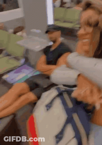 A Blurry Picture Of A Woman Holding A Man 'S Head GIF