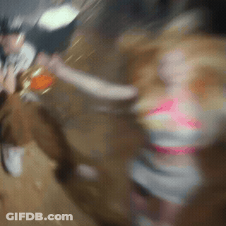 A Blurry Picture Of A Woman In A Pink Dress GIF