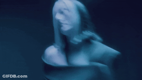 A Blurry Picture Of A Woman 'S Face And Torso GIF
