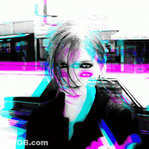 A Blurry Picture Of A Woman 'S Face With A Purple Background GIF