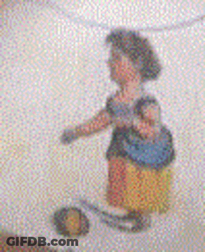 A Blurry Picture Of A Woman Standing On A Staircase Holding A Purse . GIF