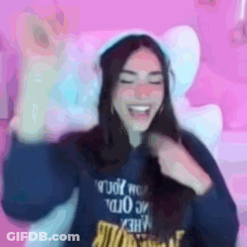 A Blurry Picture Of A Woman Wearing A Blue Sweatshirt With The Word Rude On It GIF