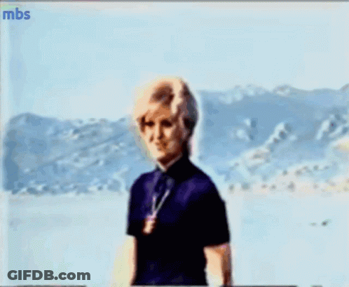 A Blurry Picture Of A Woman With Mbs Written On The Bottom Left GIF