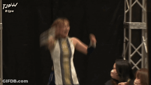A Blurry Picture Of A Woman With #Tjpw On The Bottom Right GIF