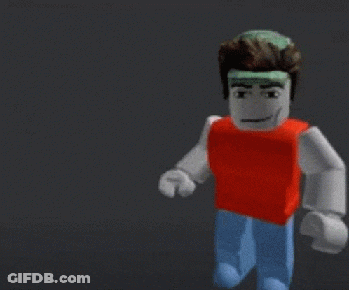 A Blurry Picture Of A Yellow And Red Lego Figure Holding A Red Ball With The Word Baller Written On It GIF