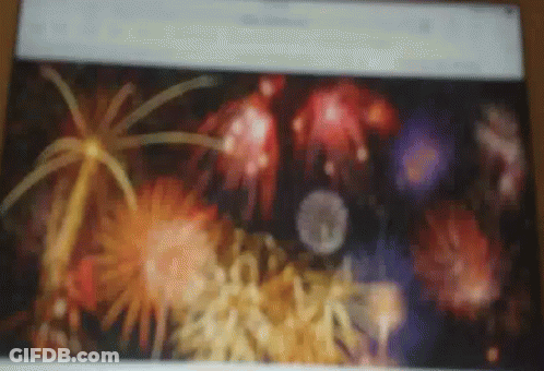 A Blurry Picture Of Fireworks Is Displayed On A Screen GIF