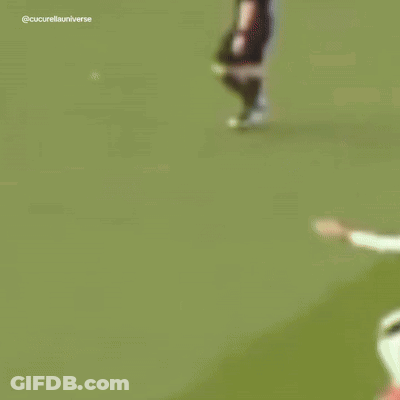 A Blurry Picture Of Soccer Players With One Wearing The Number 5 GIF