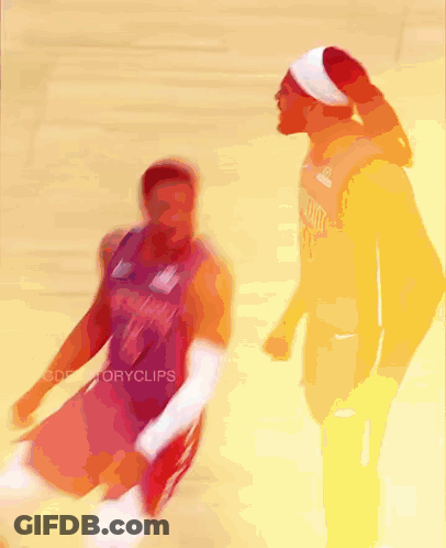 A Blurry Picture Of Two Basketball Players With One Wearing A Jersey That Says ' Miami ' On It GIF