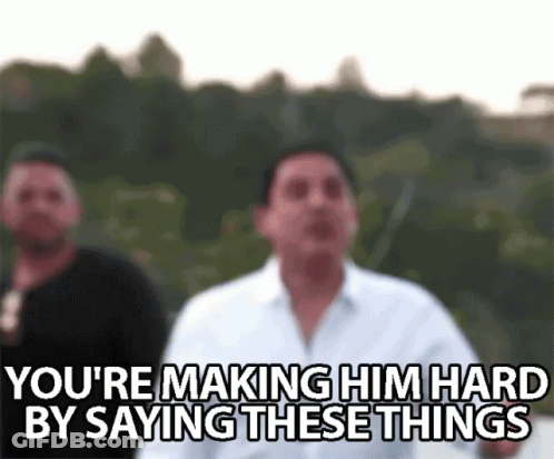 A Blurry Picture Of Two Men Standing Next To Each Other With The Caption `` You 'Re Making Him Hard By Saying These Thin GIF