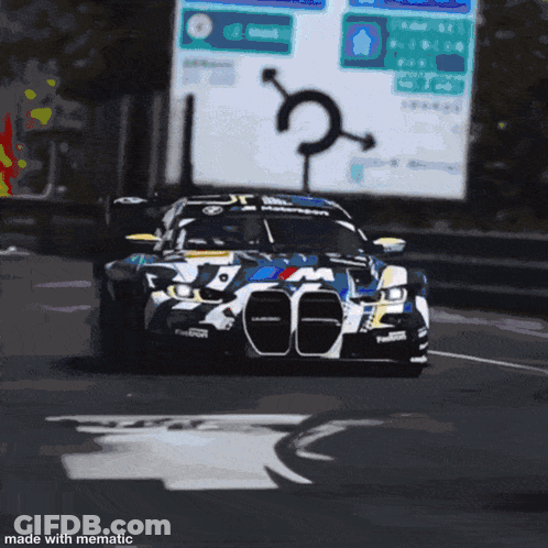 A Bmw Race Car With The Number 27 On The Front GIF