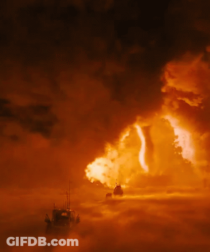 A Boat In The Middle Of A Cloudy Sky With A Fireball In The Background GIF
