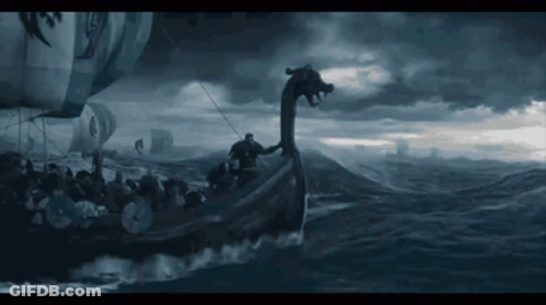 A Boat With A Dragon 'S Head On The Back Of It GIF