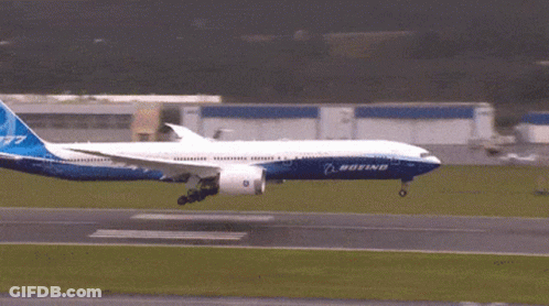A Boeing 777 Jet Is Taking Off From An Airport Runway GIF