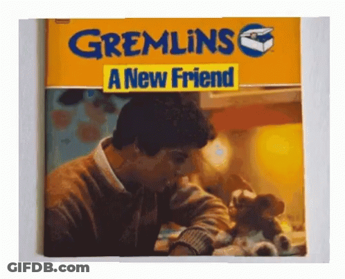 A Book Called Gremlins A New Friend Has A Picture Of A Man GIF