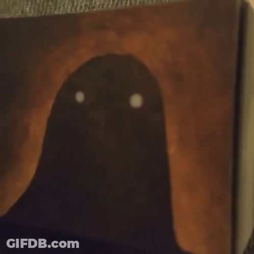 A Book Is Open To A Page That Has A Smiley Face On It GIF