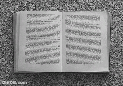 A Book Is Open To A Page That Says " I Am " GIF