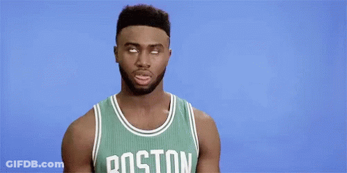 A Boston Celtics Basketball Player Is Making A Funny Face While Wearing A Green Jersey . GIF