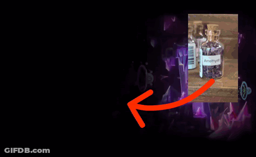 A Bottle Of Amethyst Sits On A Table GIF