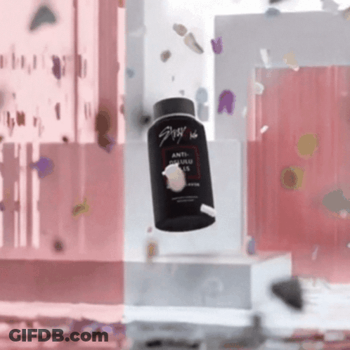 A Bottle Of Anti Dandruff Shampoo Is Falling In The Air GIF