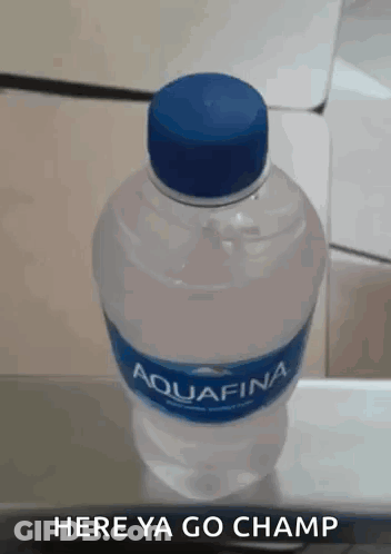 A Bottle Of Aquafina Water With A Blue Cap GIF